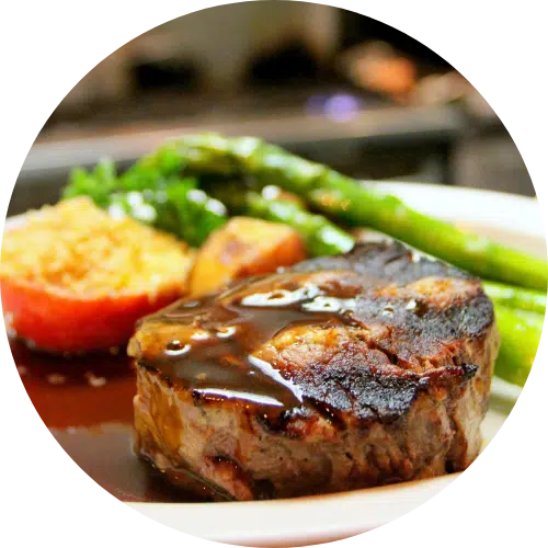 Grilled filet mignon with asparagus and stuffed tomato