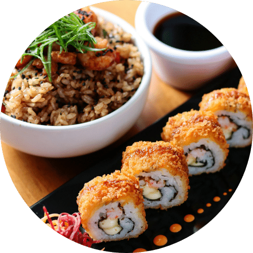 Crispy sushi rolls served with fried rice and soy sauce