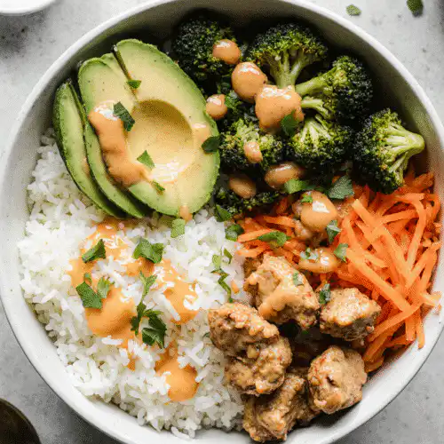 Bang Bang Chicken Bowl with crispy chicken, rice, and veggies