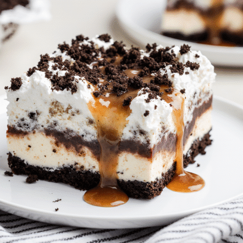 A full view of the Simple Oreo Ice Cream Dream Cake in a 9x13 pan, showing all the perfect layers, with one slice removed.