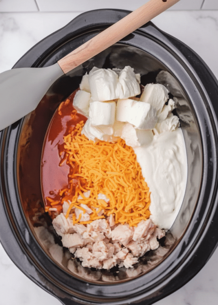 buffalo chicken dip ingredients arranged on kitchen counter