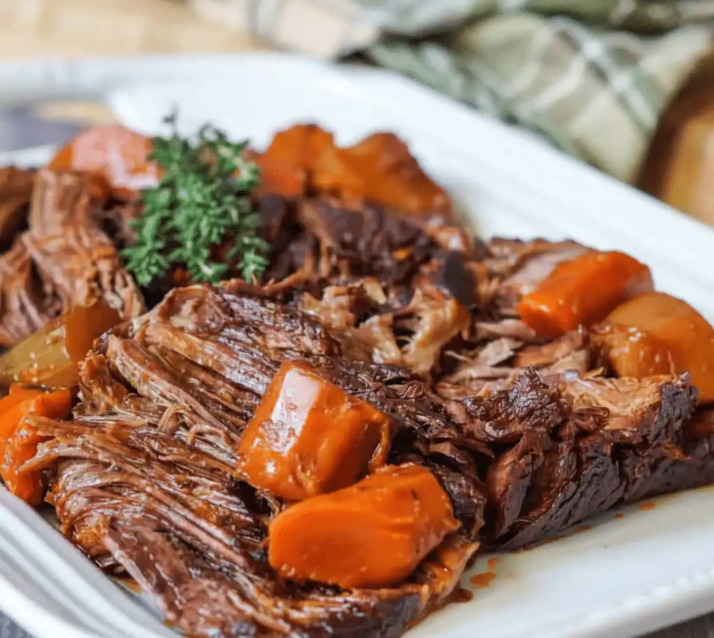Delicious French onion pot roast served with herbs and a side of vegetables. serving