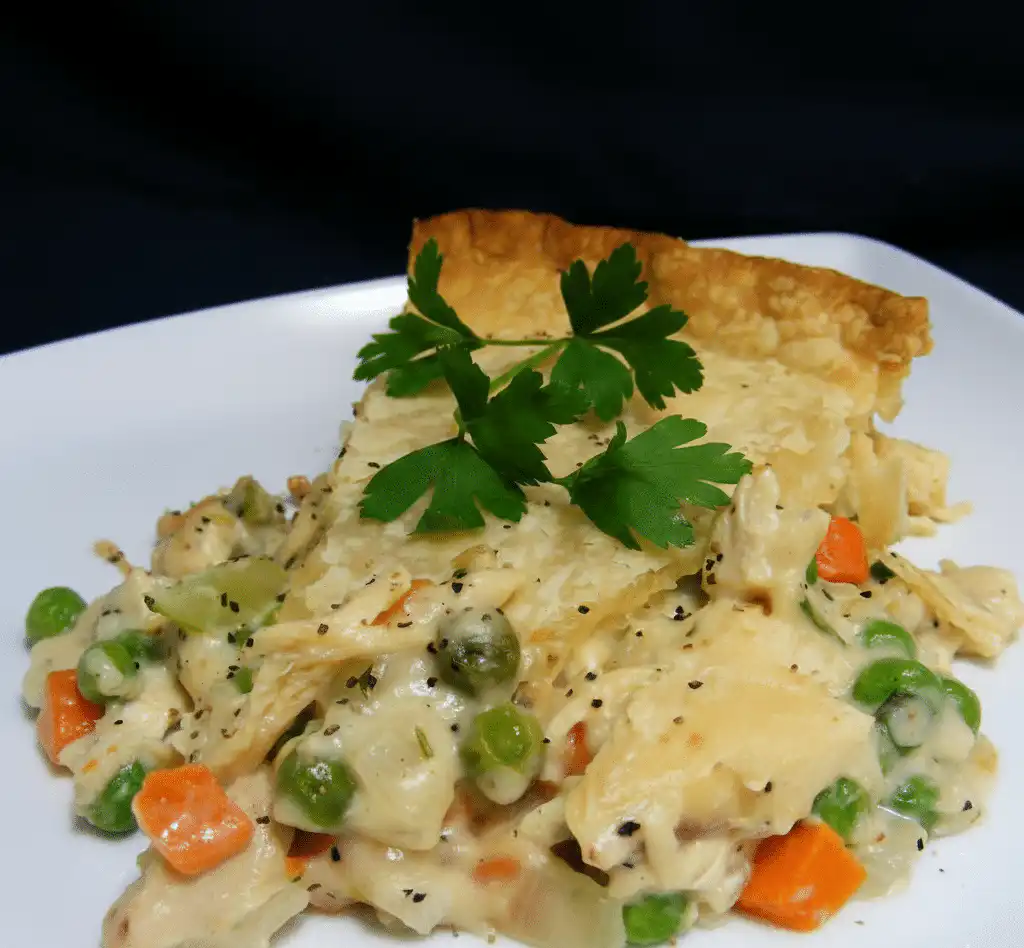 Delicious classic chicken pot pie pasta served in a bowl with herbs recipe card