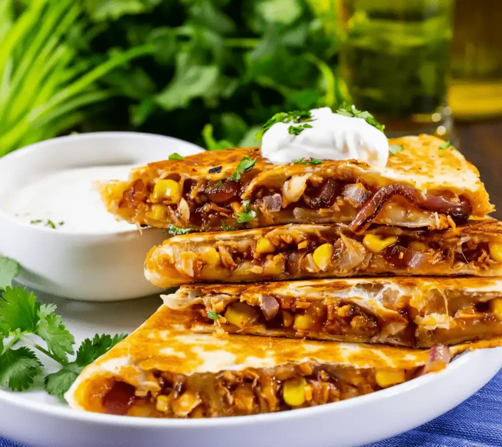 Delicious BBQ Chicken Quesadillas served with salsa and garnished with herbs recipe card