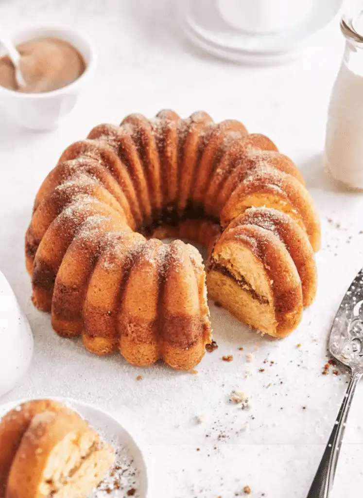 Delicious snickerdoodle Bundt cake with cinnamon and sugar topping serving