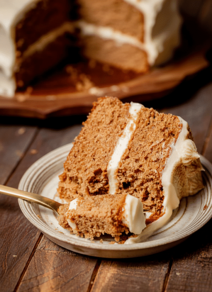 Delicious brown sugar chai cake topped with spices and a soft frosting. serving