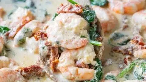 Creamy Tuscan Shrimp Recipe 1 Creamy Tuscan shrimp dish with spinach and sun-dried tomatoes served in a bowl.
