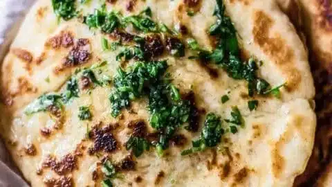 Gluten Free Naan Bread - fluffy & tender 1 Fluffy and tender gluten free naan bread on a wooden table