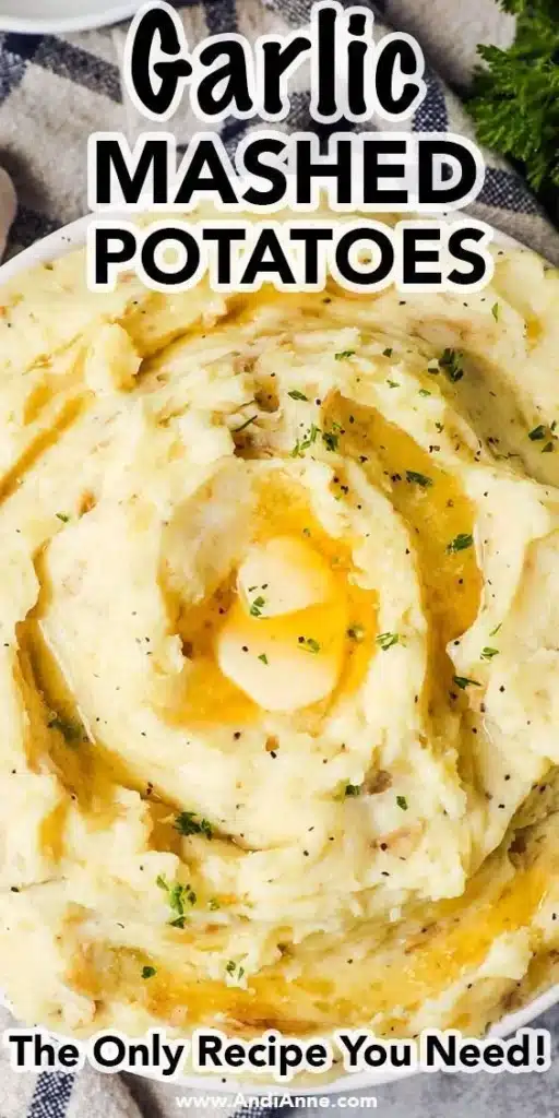 Delicious bowl of ultimate garlic mashed potatoes topped with fresh herbs