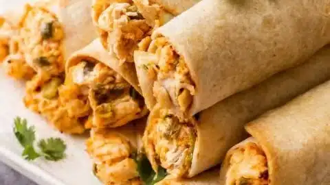 Easy Chicken Taquitos (5-Ingredients) 2 Five-ingredient chicken taquitos ready to be served
