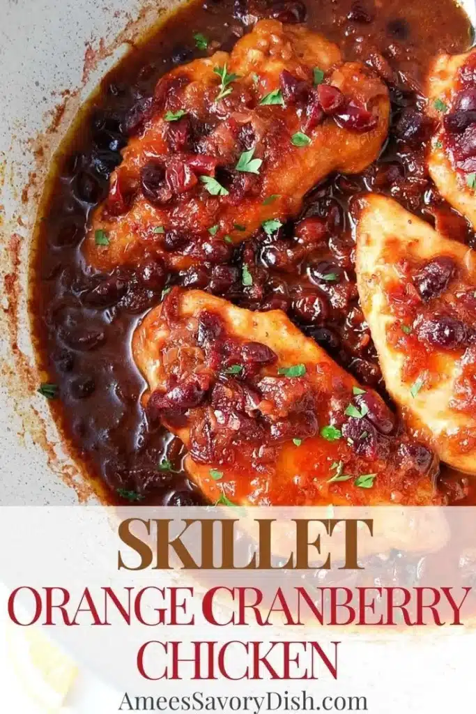 Skillet prepared orange cranberry chicken served with vibrant cranberry sauce