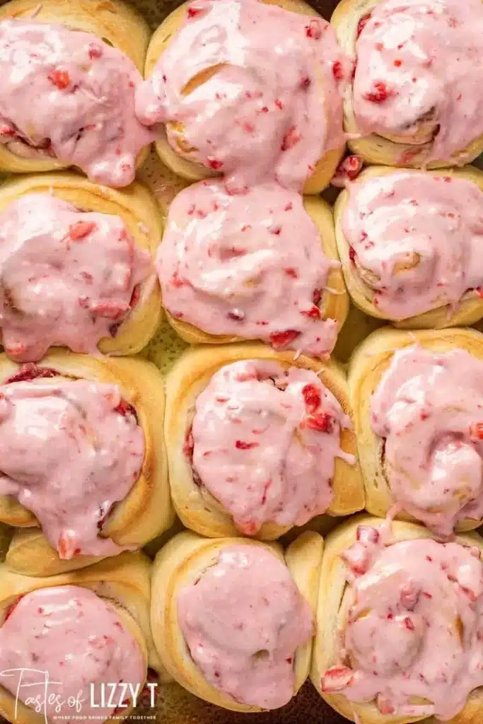 Strawberries and cream sweet rolls topped with fresh strawberries