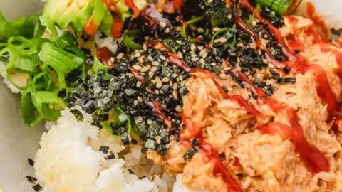 Canned Tuna Sushi Bowl 2 Canned tuna sushi bowl topped with fresh vegetables and sesame seeds