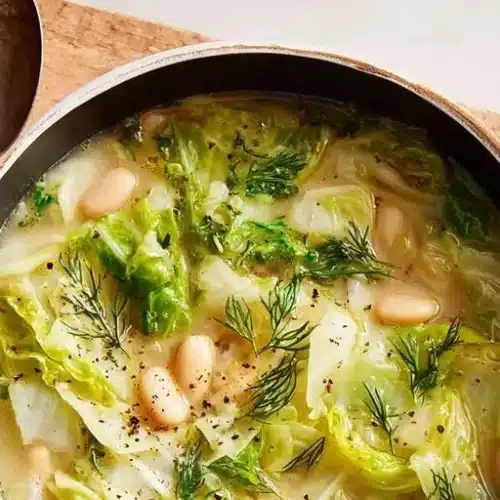 Garlicky Cabbage Soup 2 Bowl of garlicky cabbage soup garnished with fresh herbs