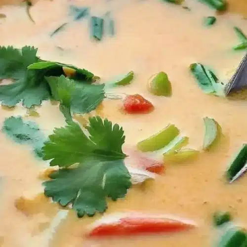 Ginger Lemongrass Soup with Coconut Milk: An Incredible 7-Step Recipe 2 Bowl of ginger lemongrass soup with coconut milk garnished with herbs.
