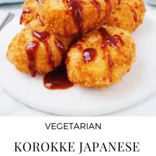 Japanese Potato Croquettes 2 Crispy Japanese potato croquettes served on a plate with dipping sauce