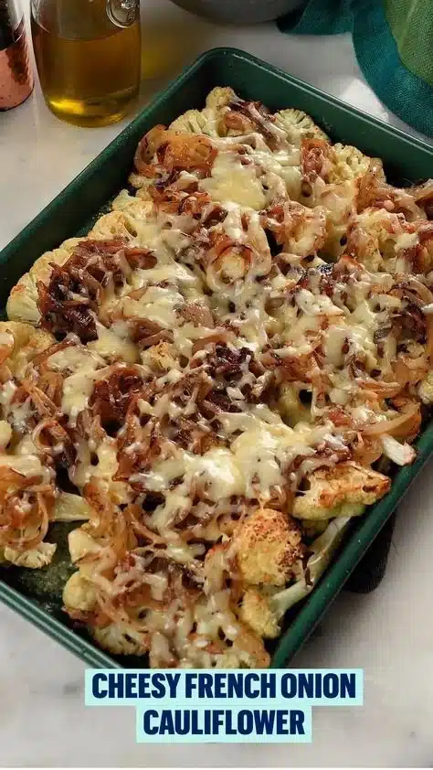 Baked Cauliflower with Gruyère Cheese and Caramelized Onions on a serving plate