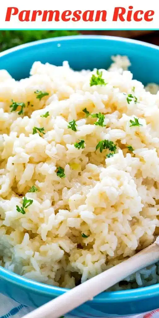 Bowl of creamy Parmesan rice garnished with herbs.