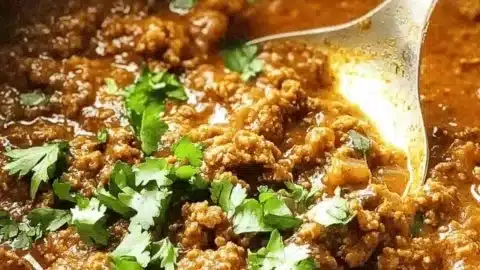 Delicious keema curry made with ground beef, spices, and served with rice.