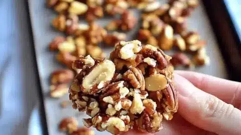 Irresistibly Crunchy Almond Pecan Clusters You’ll Love 2 Crunchy almond pecan clusters in a bowl, perfect for a healthy snack.