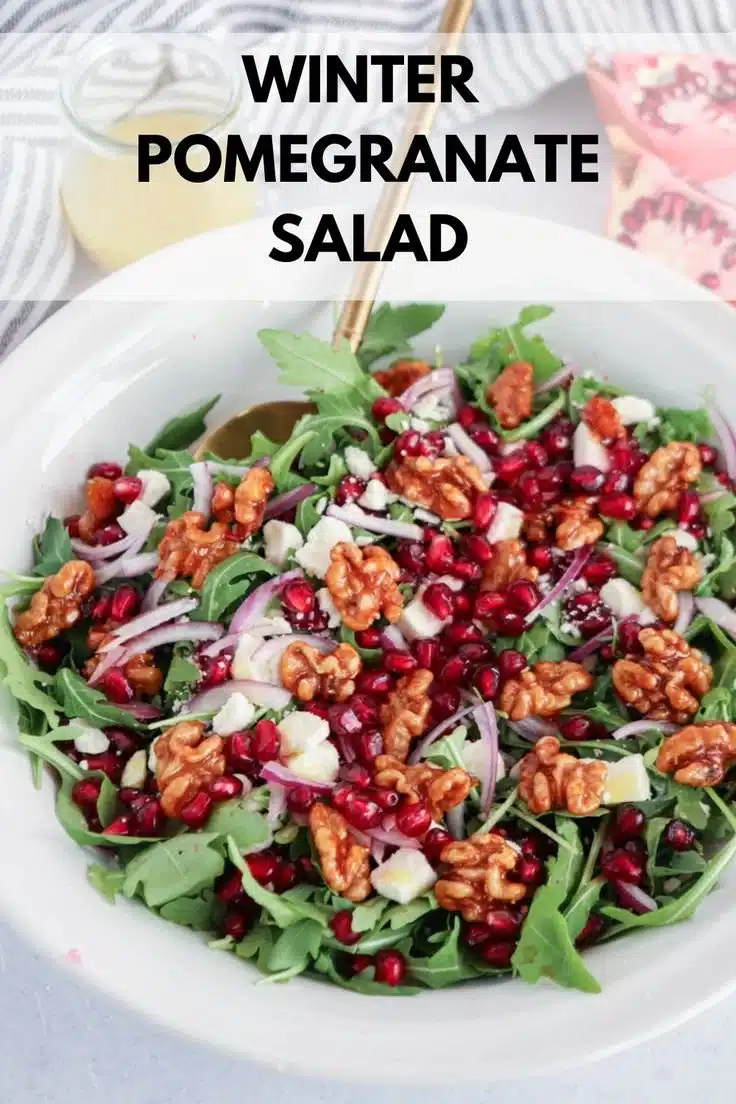 Winter Pomegranate Feta Salad with fresh greens and pomegranate seeds