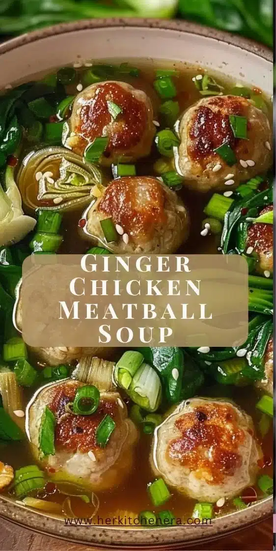 Bowl of Chicken Meatball Soup with fresh herbs and vegetables