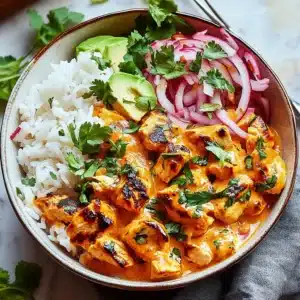 Coconut Chicken Rice Bowl with fresh herbs and colorful vegetables