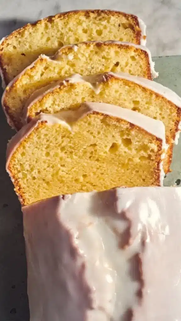 Slice of homemade lemon loaf inspired by Starbucks recipe