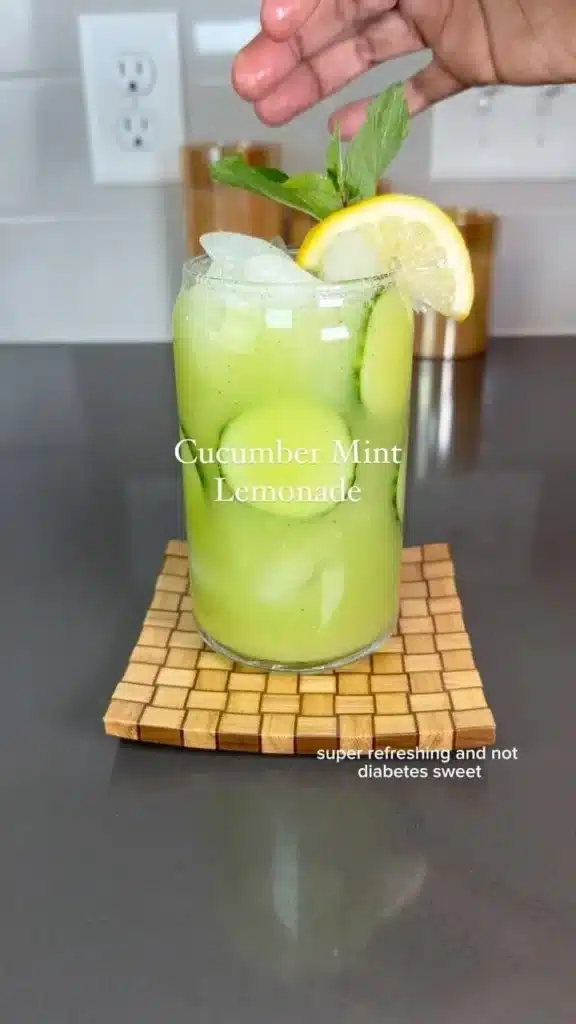 Glass of Cucumber Mint Lemonade garnished with cucumber slices and mint leaves
