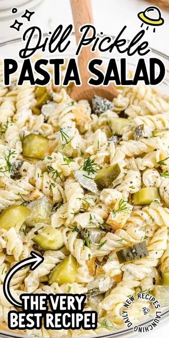 Dill Pickle Pasta Salad garnished with dill and cheese in a bowl.