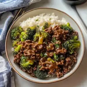 Plate of ground beef and broccoli stir-fry with rice