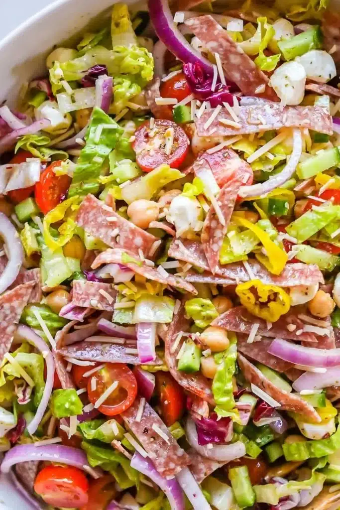 Serving of Italian Chopped Salad with fresh vegetables and dressing