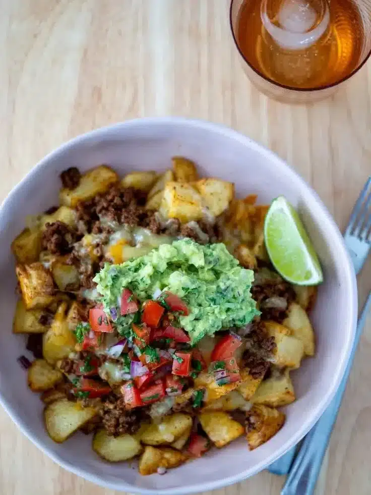 Loaded Potato Taco Bowl with toppings including cheese and salsa