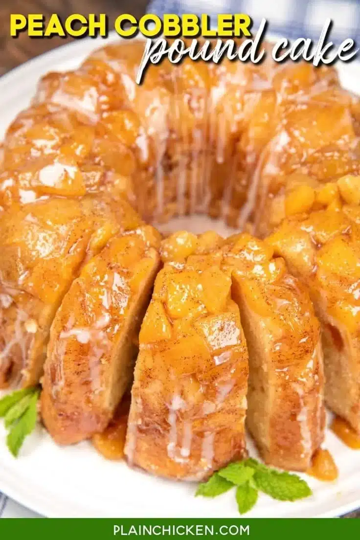 Sliced Peach Cobbler Pound Cake on a plate with fresh peaches and a scoop of ice cream