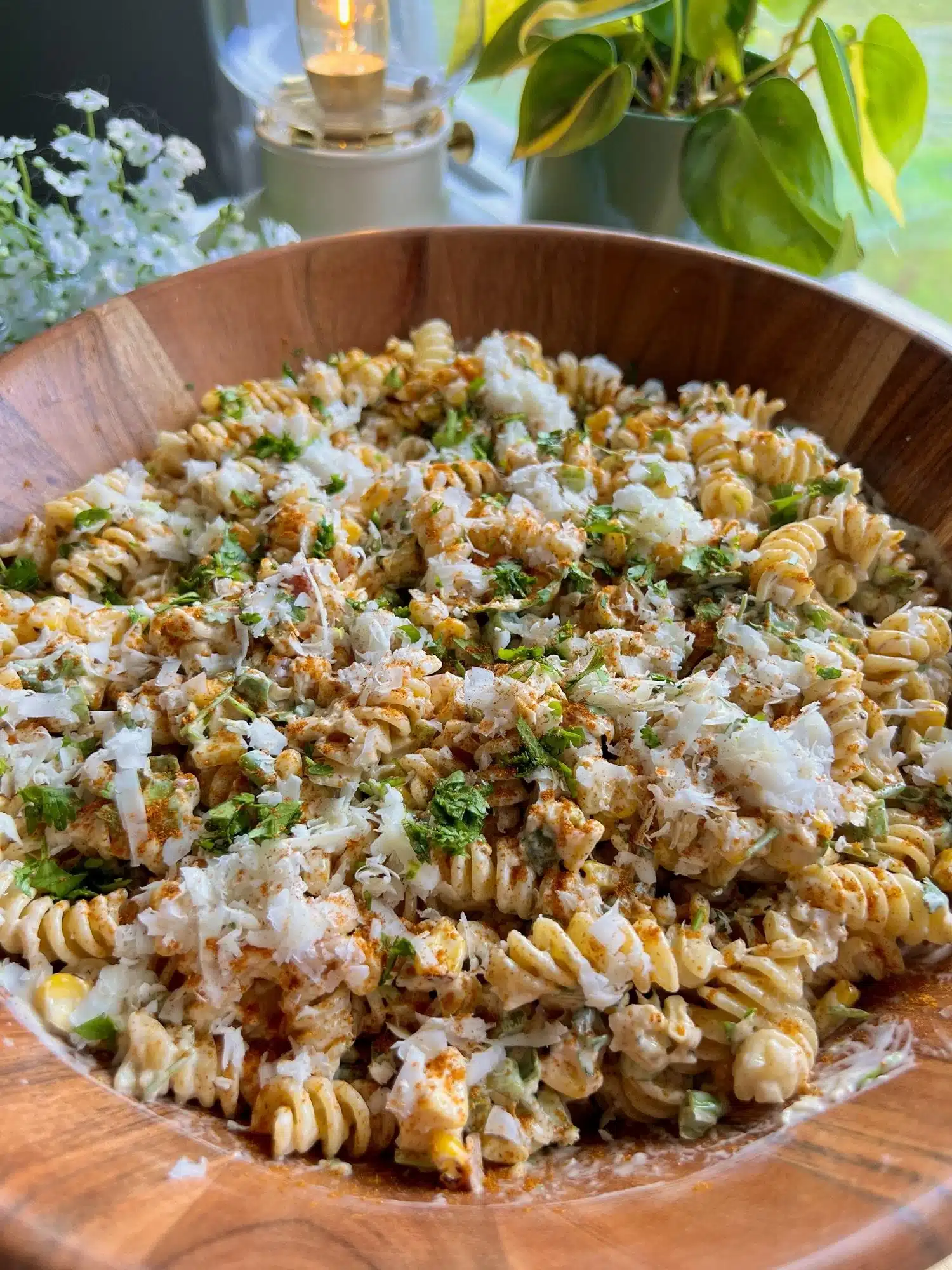 Delicious street corn pasta salad garnished with fresh herbs and spices.