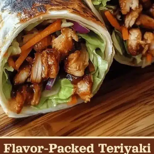 Teriyaki chicken wrap with fresh vegetables and sauce, served on a plate.