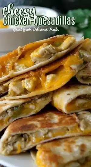 Delicious cheesy chicken quesadillas served on a plate with fresh ingredients