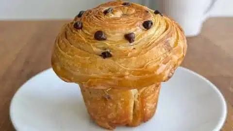 Chocolate chip sourdough cruffins with flaky layers and rich chocolate chips.