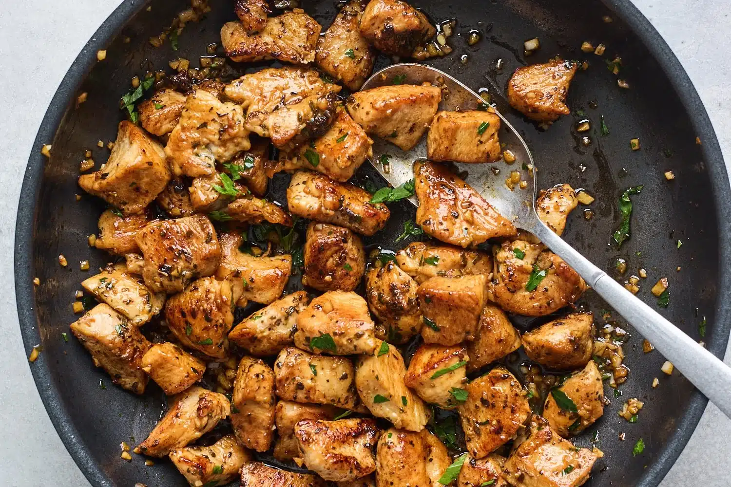 Delicious garlic butter chicken bites served in a white plate