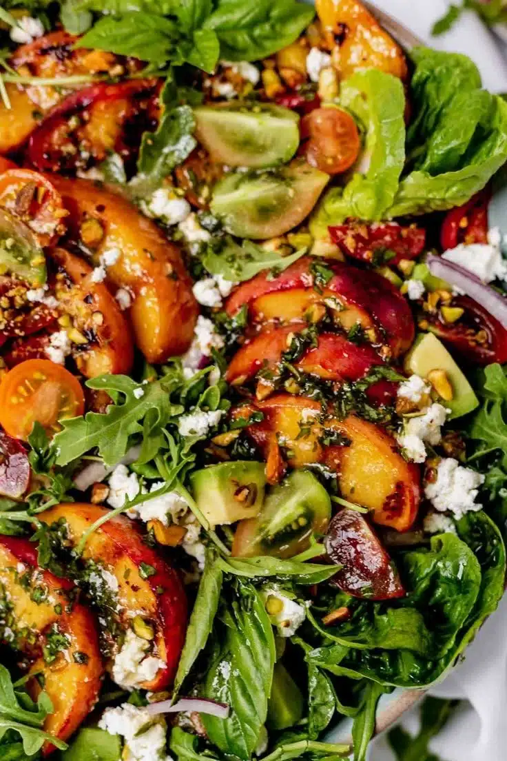 Delightful grilled peach salad with greens and zesty dressing
