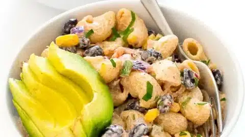 Colorful bowl of Mexican Pasta Salad with fresh vegetables and herbs